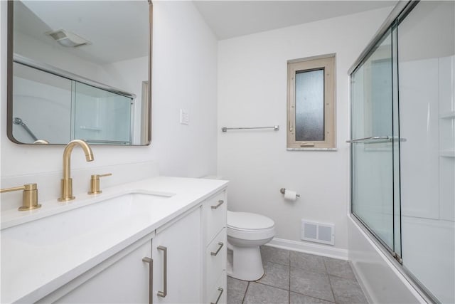 126 Woodhall Dr, Baldwin Boro, PA 15236 - bathroom featuring vanity, baseboards, tile patterned floors, toilet, and combined bath / shower with glass door