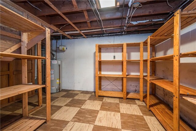 126 Woodhall Dr, Baldwin Boro, PA 15236 - unfinished basement with water heater and tile patterned floors