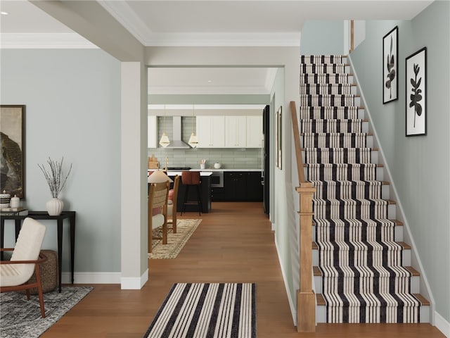 4049 Windsfield Way S, Fayette, PA 15017 - stairway featuring wood finished floors, ornamental molding, and baseboards