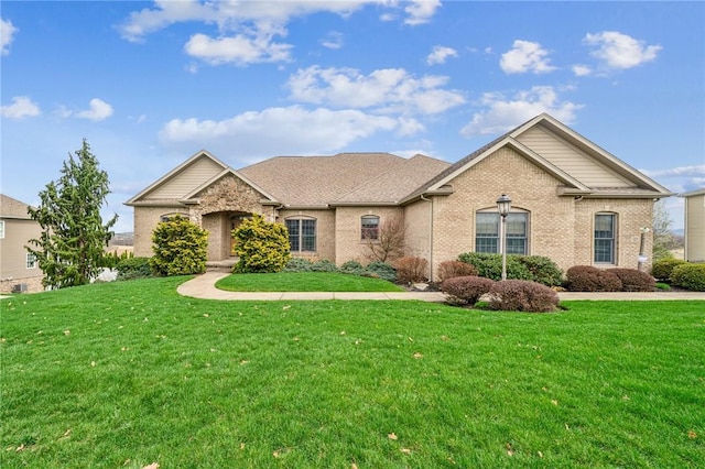 127 Chelsea Dr, Unity Twp, PA 15650 - view of front facade featuring brick siding and a front yard