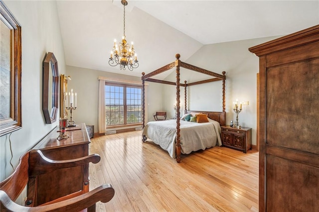 127 Chelsea Dr, Unity Twp, PA 15650 - bedroom featuring vaulted ceiling, a chandelier, and light wood-style flooring