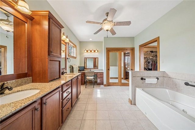 127 Chelsea Dr, Unity Twp, PA 15650 - full bath with double vanity, a ceiling fan, tile patterned floors, a bath, and a walk in closet