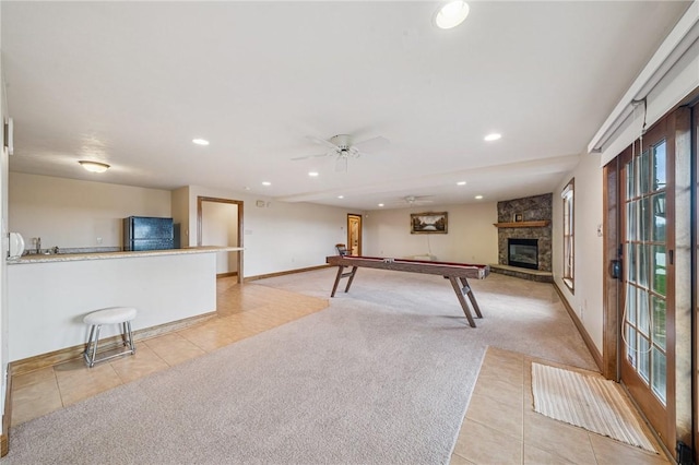 127 Chelsea Dr, Unity Twp, PA 15650 - playroom with light tile patterned flooring, light colored carpet, baseboards, a fireplace, and recessed lighting