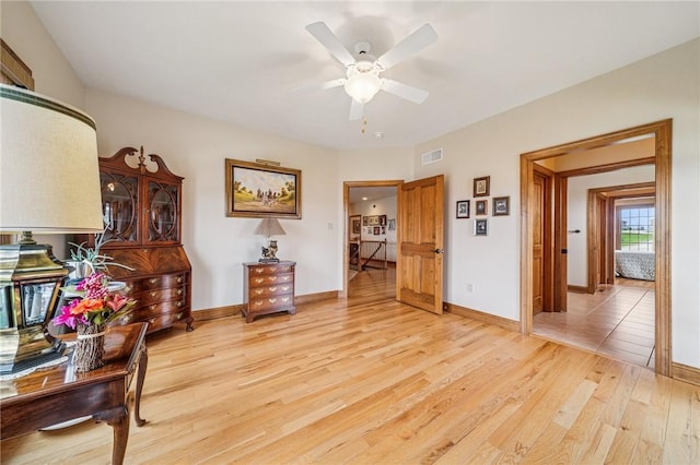 127 Chelsea Dr, Unity Twp, PA 15650 - living area featuring light wood-style floors, ceiling fan, and baseboards