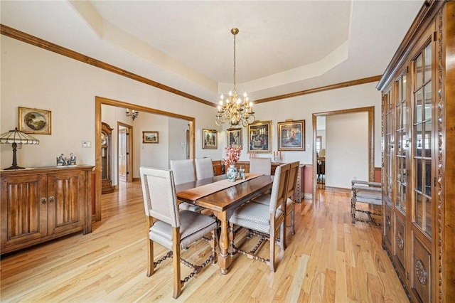 127 Chelsea Dr, Unity Twp, PA 15650 - dining room with a tray ceiling, a chandelier, light wood finished floors, french doors, and crown molding