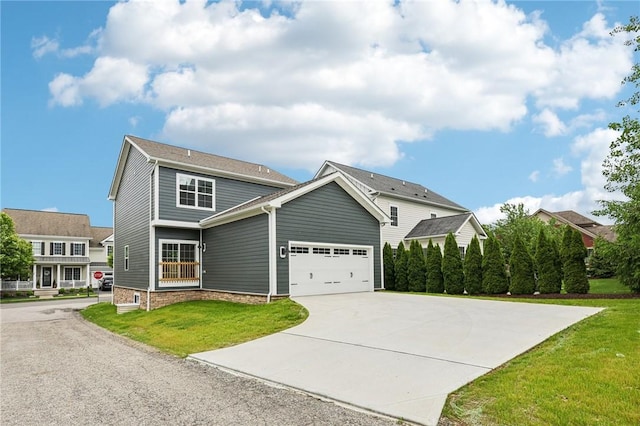 1213 Newbury Highland, South Fayette, PA 15017 - view of front of home with driveway, a front yard, and an attached garage