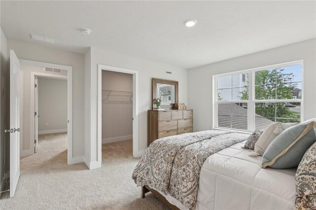 1213 Newbury Highland, South Fayette, PA 15017 - bedroom featuring light colored carpet, baseboards, a spacious closet, and a closet