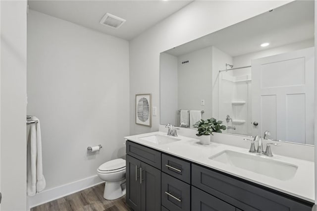 1213 Newbury Highland, South Fayette, PA 15017 - full bath with toilet, wood finished floors, double vanity, baseboards, and a shower