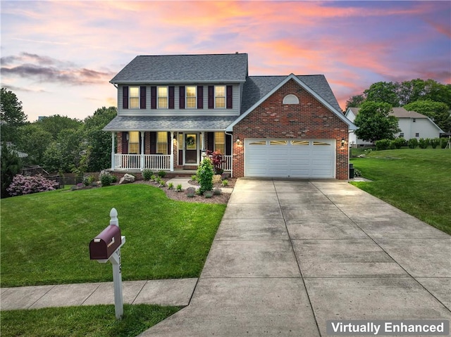 115 Lawrence Dr, Brighton Twp, PA 15009 - view of front of house featuring covered porch, concrete driveway, a lawn, and a garage