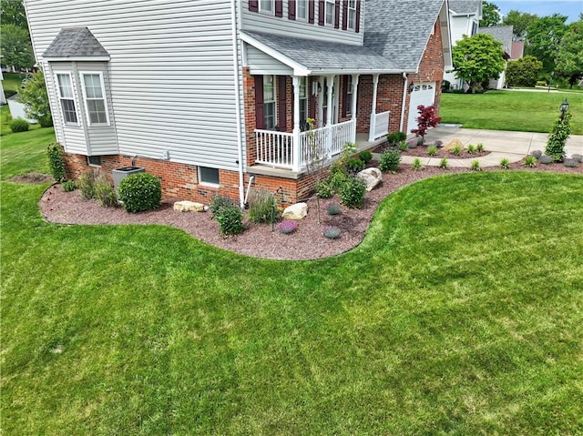 115 Lawrence Dr, Brighton Twp, PA 15009 - view of side of property featuring covered porch, a shingled roof, a lawn, central AC, and driveway