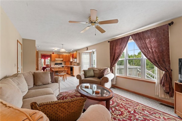 115 Lawrence Dr, Brighton Twp, PA 15009 - living area with baseboards, light colored carpet, and ceiling fan