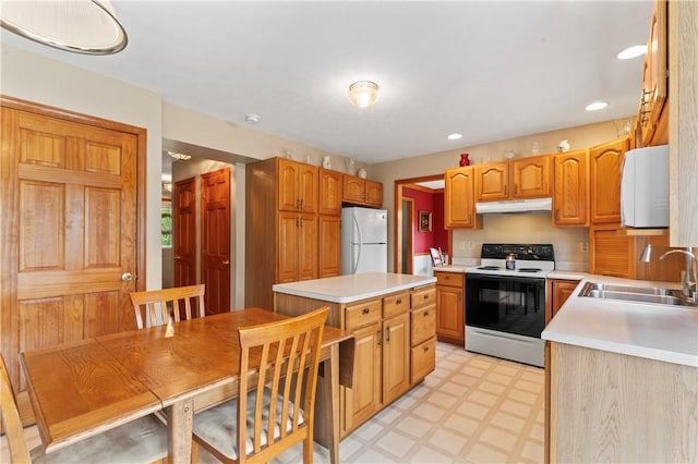115 Lawrence Dr, Brighton Twp, PA 15009 - kitchen with electric range, freestanding refrigerator, a sink, light flooring, and under cabinet range hood