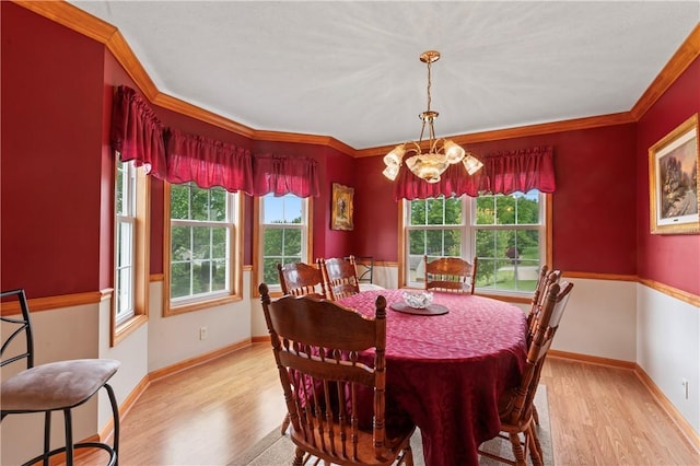 115 Lawrence Dr, Brighton Twp, PA 15009 - dining space with light wood-style floors, healthy amount of natural light, crown molding, a chandelier, and baseboards