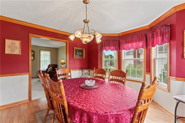 115 Lawrence Dr, Brighton Twp, PA 15009 - dining room featuring a chandelier, plenty of natural light, wood finished floors, and crown molding
