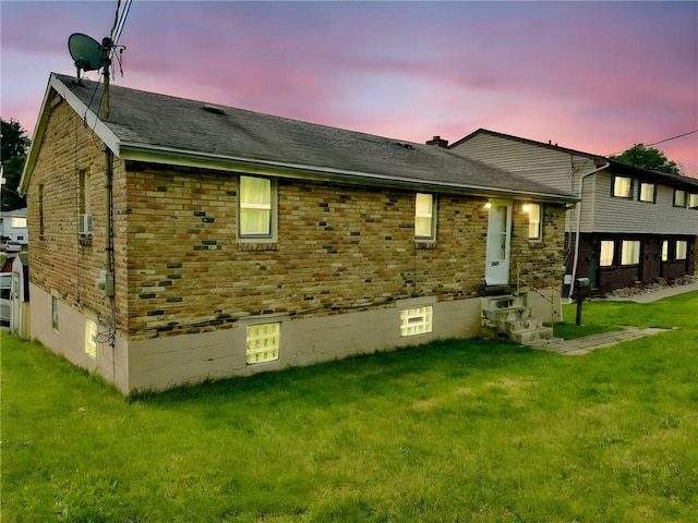 1230 Frank Ave, Jeannette, PA 15644 - rear view of property with a yard, entry steps, and brick siding