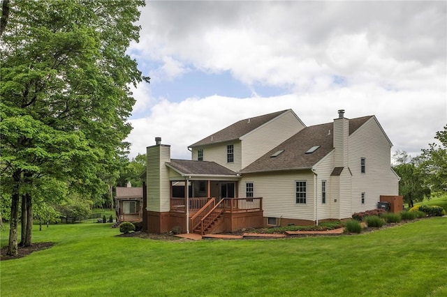 929 White Water, Adams Twp, PA 16046 - rear view of house with a chimney, a lawn, a deck, and stairway