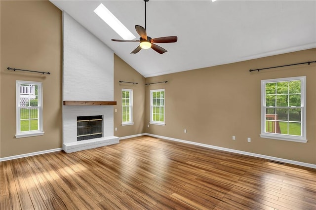 929 White Water, Adams Twp, PA 16046 - unfurnished living room featuring wood-type flooring, baseboards, high vaulted ceiling, and plenty of natural light