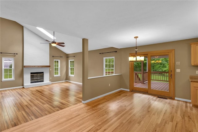 929 White Water, Adams Twp, PA 16046 - unfurnished living room featuring light wood-style flooring, baseboards, healthy amount of natural light, and lofted ceiling