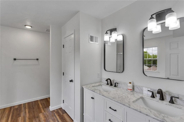 929 White Water, Adams Twp, PA 16046 - bathroom featuring double vanity, wood finished floors, a closet, and baseboards