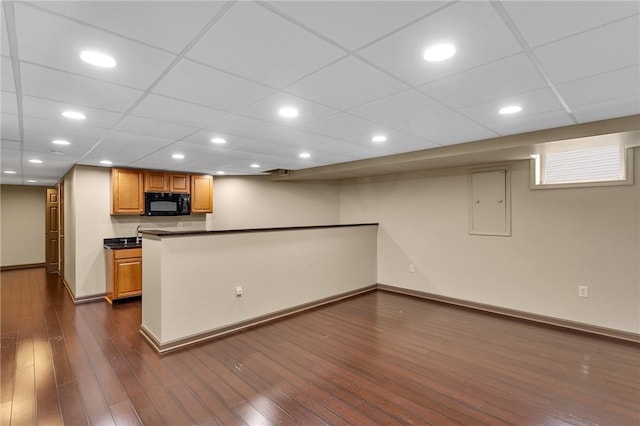 929 White Water, Adams Twp, PA 16046 - kitchen featuring black microwave, dark countertops, baseboards, dark wood-style flooring, and a peninsula