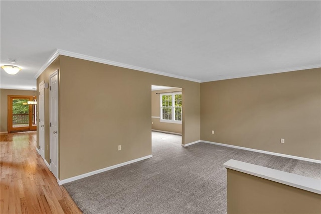 929 White Water, Adams Twp, PA 16046 - unfurnished room featuring baseboards, ornamental molding, and light wood-style floors