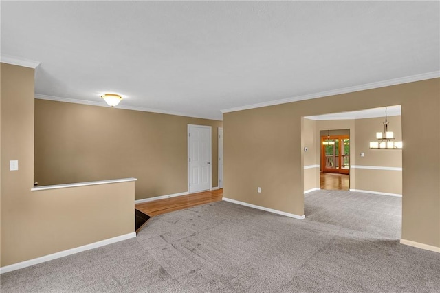 929 White Water, Adams Twp, PA 16046 - empty room featuring a chandelier, crown molding, carpet floors, and baseboards