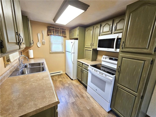 261 Lacock St, Canton Twp, PA 15301 - kitchen with white appliances, a sink, baseboard heating, light wood finished floors, and light countertops