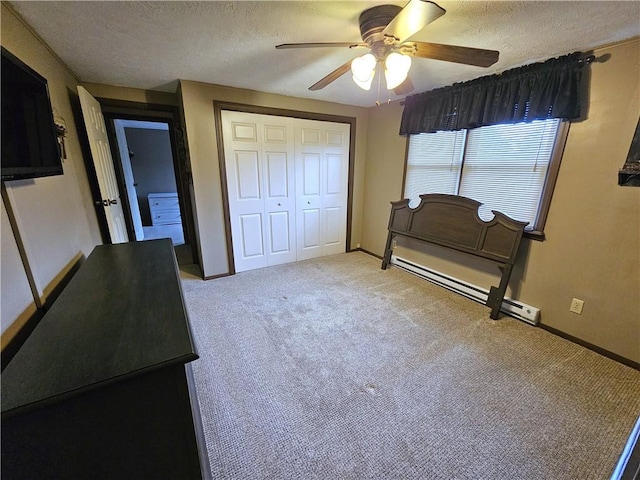 261 Lacock St, Canton Twp, PA 15301 - carpeted bedroom with a textured ceiling, a closet, a baseboard radiator, baseboards, and ceiling fan