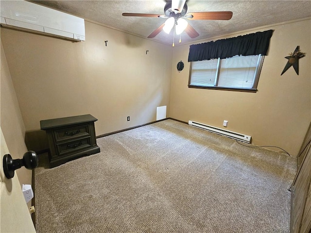 261 Lacock St, Canton Twp, PA 15301 - empty room with a baseboard radiator, an AC wall unit, a textured ceiling, a ceiling fan, and carpet