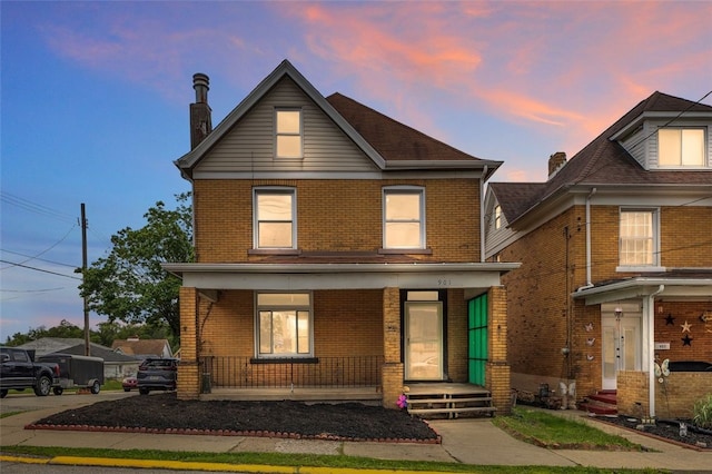 901 Punta Gorda Ave, East Mckeesport, PA 15035 - view of front facade featuring brick siding and a porch