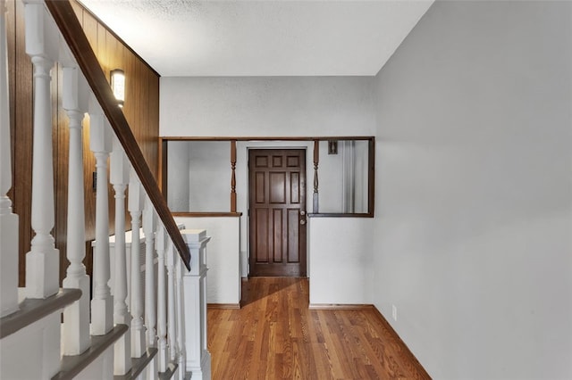 901 Punta Gorda Ave, East Mckeesport, PA 15035 - entrance foyer with wood finished floors, stairway, and a textured ceiling