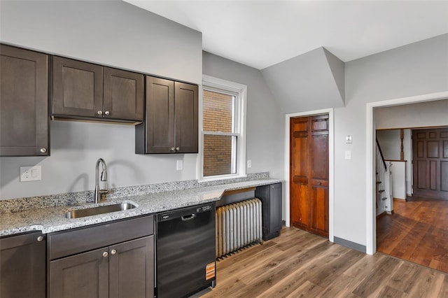901 Punta Gorda Ave, East Mckeesport, PA 15035 - kitchen featuring black dishwasher, radiator heating unit, a sink, light wood-style floors, and dark brown cabinets