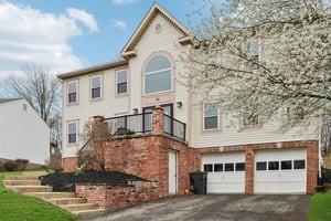412 Rose Dr, Cranberry Twp, PA 16066 - view of front facade featuring asphalt driveway and a garage