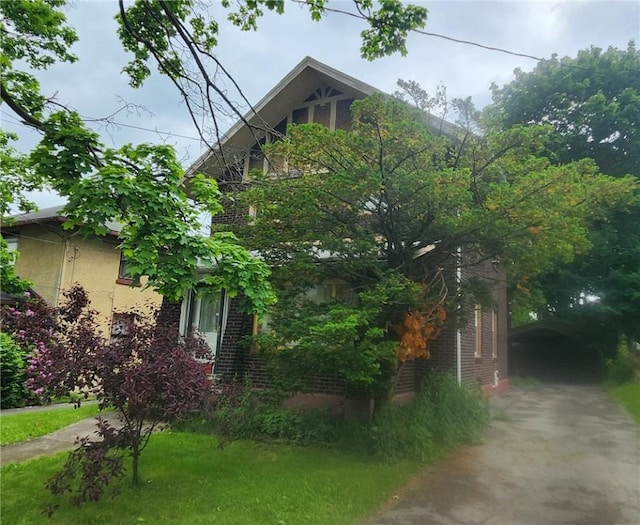 17 Shenango Blvd, Farrell, PA 16121 - view of front of property with brick siding and a front yard