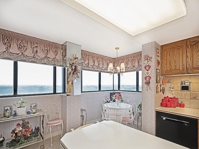 1 Trimont Ln Unit 2115A, Mt Washington, PA 15211 - bathroom featuring a freestanding bath, decorative backsplash, and tile patterned floors