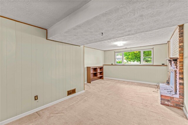 344 Fruitwood Dr, Bethel Park, PA 15102 - basement with a textured ceiling, baseboards, carpet flooring, and a fireplace