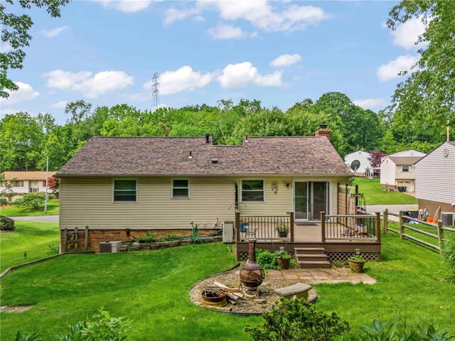 344 Fruitwood Dr, Bethel Park, PA 15102 - rear view of house with a wooden deck, a chimney, central air condition unit, and a shingled roof