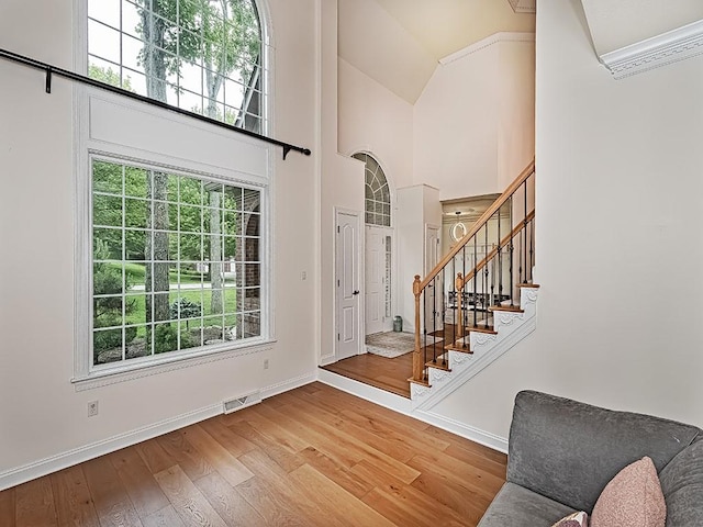 906 Big Bear Ct, Adams Twp, PA 15044 - entryway featuring stairs, high vaulted ceiling, wood finished floors, and baseboards