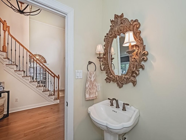 906 Big Bear Ct, Adams Twp, PA 15044 - bathroom featuring wood finished floors, a sink, and baseboards