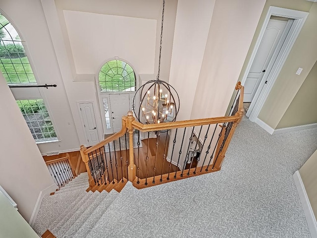 906 Big Bear Ct, Adams Twp, PA 15044 - stairway featuring a chandelier, carpet floors, a towering ceiling, healthy amount of natural light, and baseboards