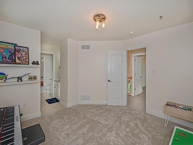 906 Big Bear Ct, Adams Twp, PA 15044 - unfurnished room with light colored carpet, baseboards, light tile patterned floors, heating unit, and fire sprinkler in ceiling