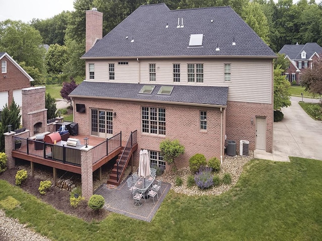 906 Big Bear Ct, Adams Twp, PA 15044 - rear view of house featuring a patio, brick siding, a chimney, a lawn, and a deck