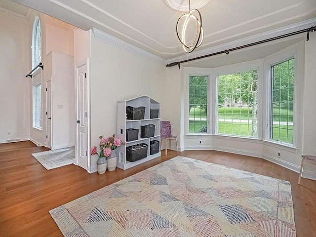 906 Big Bear Ct, Adams Twp, PA 15044 - living area featuring wood finished floors, plenty of natural light, ornamental molding, and baseboards