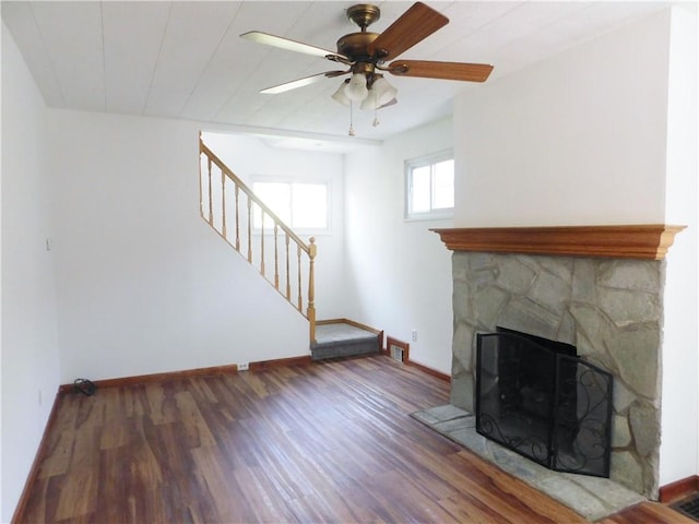 2300 Fairland St, Overbrook, PA 15210 - unfurnished living room with wood finished floors, stairs, a fireplace, and baseboards