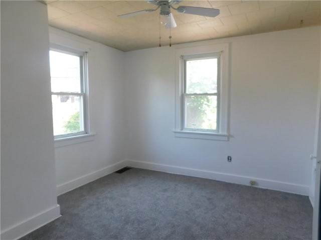 2300 Fairland St, Overbrook, PA 15210 - unfurnished room with dark colored carpet, ceiling fan, and baseboards