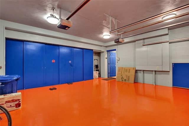 222 Schenley Rd, Squirrel Hill, PA 15217 - garage featuring a garage door opener and concrete block wall