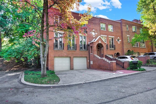 222 Schenley Rd, Squirrel Hill, PA 15217 - view of front of house with driveway, a garage, and brick siding