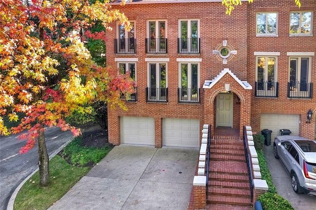222 Schenley Rd, Squirrel Hill, PA 15217 - view of front facade featuring an attached garage, brick siding, and concrete driveway