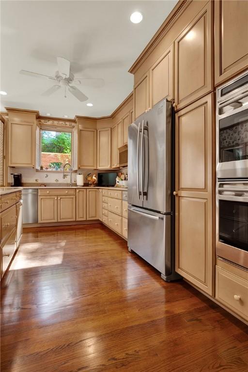 222 Schenley Rd, Squirrel Hill, PA 15217 - kitchen with appliances with stainless steel finishes, ceiling fan, wood finished floors, a sink, and light countertops