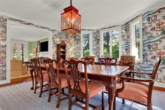 222 Schenley Rd, Squirrel Hill, PA 15217 - dining room with wallpapered walls, ornamental molding, plenty of natural light, wood finished floors, and a chandelier